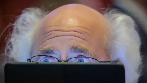 Brendan McDermid/Reuters Traders work on the floor at the New York Stock Exchange