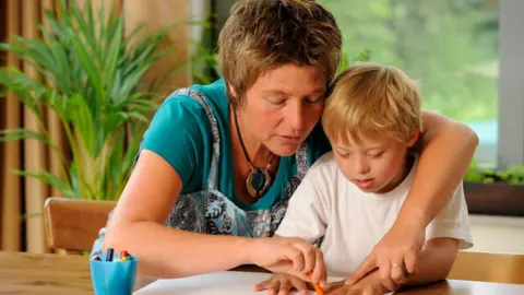 Oxfordshire County Council Adult teaching a child