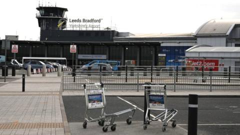 Leeds United team plane met by airport emergency crews - BBC News