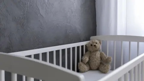 Thinkstock Teddy bear in cot