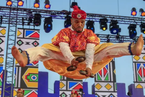 Jalal Morchidi/EPA A member of the Moallem Houssem Ghina Ensemble performs onstage during the 24th edition of the Gnaoua World Music Festival in Essaouira, Morocco - Friday 23 June 2023