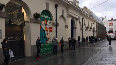 BBC Queues outside a St Peter Port supermarket