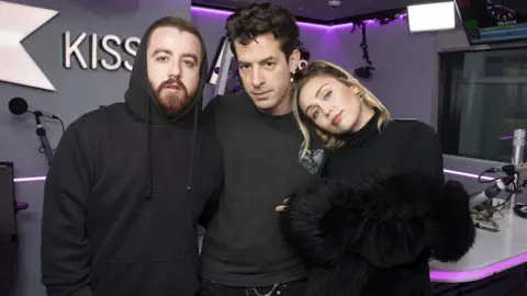 Getty Images Tom Green, Mark Ronson, Miley Cyrus
