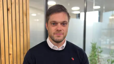 BBC/Becki Bowden Ben Davis-Rice looking at the camera.