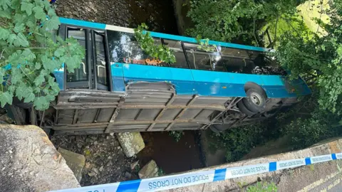 The aftermath of the crash on August 3 at Grosmont Bridge, where a bus plunged into the river.