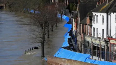 Reuters Flood defences are seen after being pushed back by high water levels, on the River Severn, Ironbridge