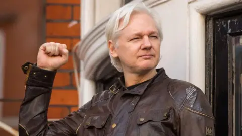 PA Media Julian Assange
