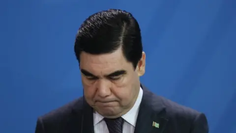 Getty Images Gurbanguly Berdymukhamedov looking downward