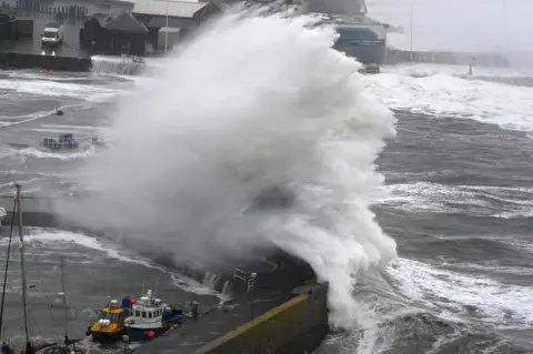 PA Media waves in stonehaven