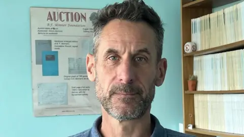 Professor Simon Dymond in his office at Swansea University