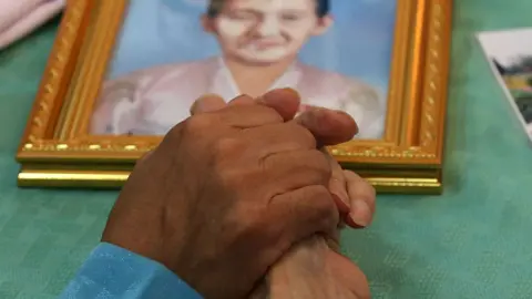 Getty Images South Korean Choi Dong-Guy, 84 (R) holds hand with his North Korean relative Park Chun-Hwa, 58 (L)