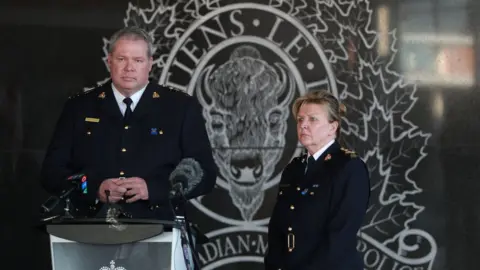 AFP via Getty Images RCMP Chief Supt Chris Leather and commanding officer Lee Bergerman deliver a news conference concerning the deadly shooting rampage