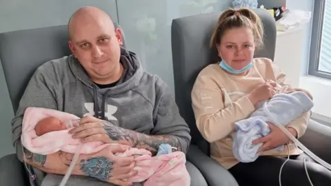 Family photo Chris Carey and Laura Hough with the twins