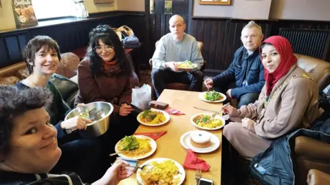 Sâmân Jamshidifard Guests to the launch event in The Corner House enjoying curry