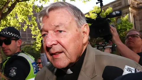 Getty Images George Pell arriving at a Melbourne court on Wednesday for the start of his sentence hearing