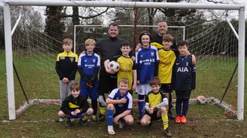 Andrew Woodger/BBC Sam Nunn with Holbrook Hornets under-10 squad members