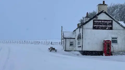 BBC Weather Watchers | Uwchaled Snow covering the road near The Sportsmans Arms, near Cerrigydrudion, Conwy county