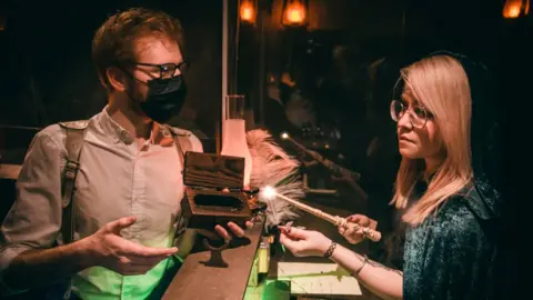 The Cauldron Company A person takes a workshop in making a magic wand