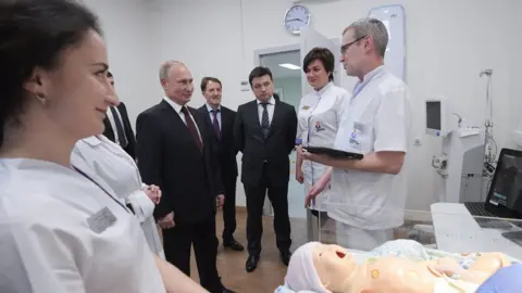 Getty Images Vladimir Putin visits a perinatal centre in Kolomna in 2018