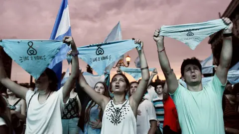 Reuters Protesters against legalising abortion carried signs reading "two lives" and wore crosses