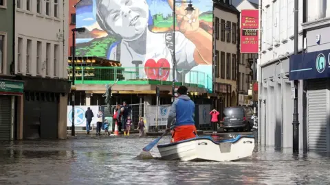 Man on boat in Newry flood