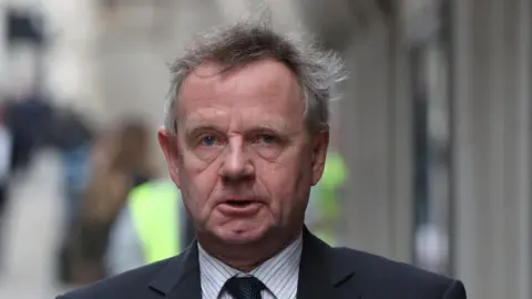 PA Andy Hill arriving at court