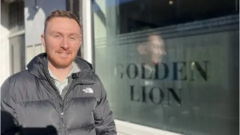 Luke Carroll outside the Golden Lion