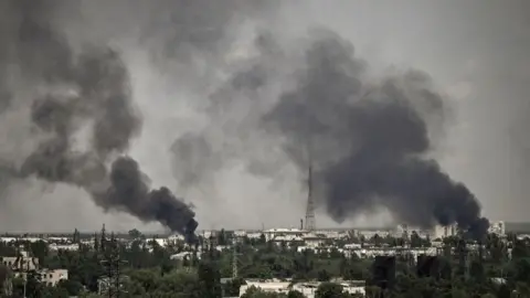 Getty Images Smoke rises over Severdonetsk, in Ukraine's Luhansk region