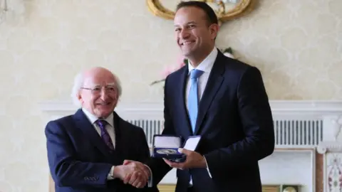 PA Michael D Higgins presents Leo Varadkar with the seals of office