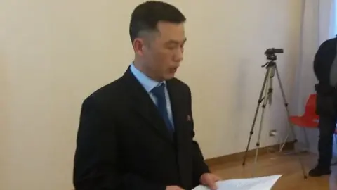 www.kimjongun.it Jo Song-gil reads report at embassy reception in Rome in April 2018