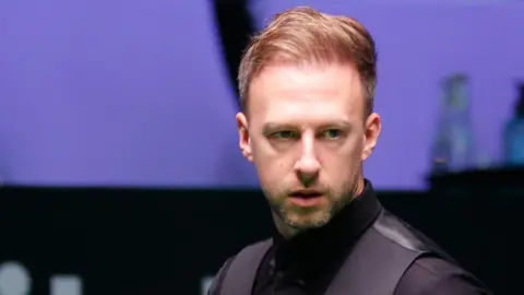 Judd Trump assesses his options at the table during the Riyadh Season Snooker Championship