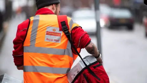 Getty Images Postman with parcels