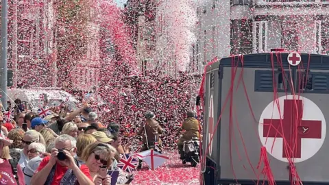 Lee Hopkins Confetti at the Liberation Day parade