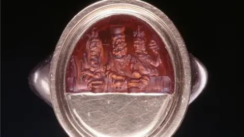 British Museum A Roman sard gem engraved with representations of the "divine couple" Serapis and Isis