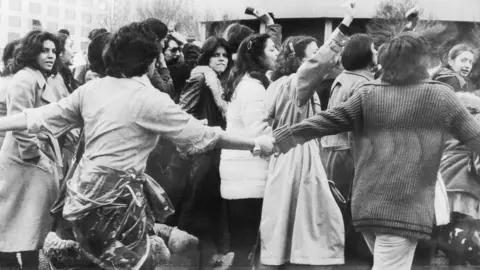 Getty Images Women protesting in Iran in March 1979 with their hair uncovered