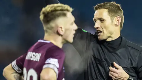 Referee Steven McLean books Kilmarnock's Jordan Jones