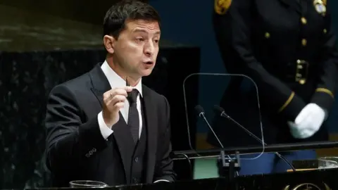 EPA Ukraine's President Volodymyr Zelensky holds up a bullet while addressing the UN General Assembly on 25 September