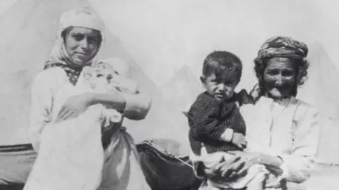Getty Images Armenian refugees at a camp in 1915