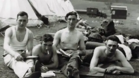 Peter Blyth Guardsman David Blyth, second from left, relaxes with unknown comrades
