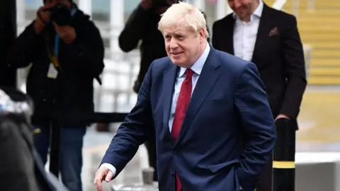 Getty Images Prime Minister Boris Johnson arrives for the third day of the Conservative Party Conference at Manchester Central