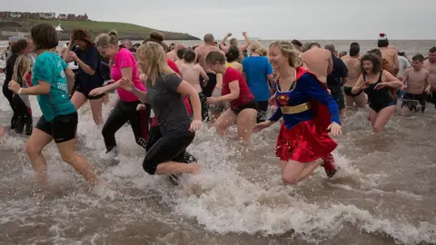 Getty Images Beaches around the country have seen thousands turn up each year to brave the icy waters