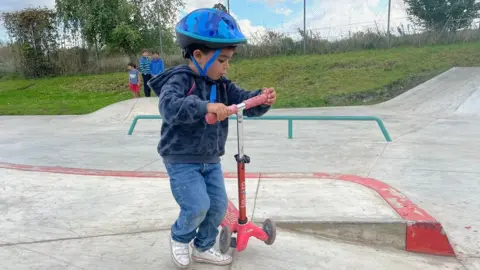 Katherine Ganczakowski/BBC Boy with scooter, Haslingfield