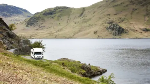 Getty Images Stock image of a camper van parked at Crummock Water.