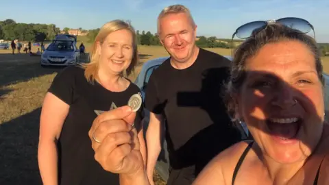 Karen Wason Karen holding the pendant with met detectors Richard and Victoria