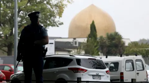 Getty Images Policeman stands outside a Christchurch mosque