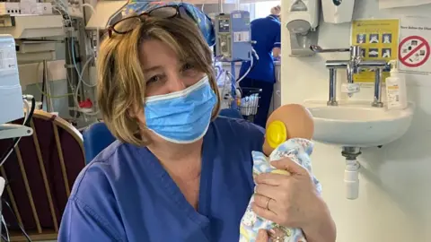 Government of Jersey Neonatal unit manager Anne Patterson demonstrates how the ear defenders work