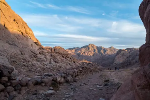 Nour el Din Sherif Jebel Katherina looms high over hikers on the Sinai Trail