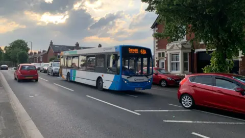 BBC/Billy Hotchkiss A 63A bus to Durranhill travelling through Carlisle in heavy traffic.