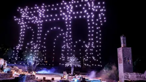 FADEL SENNA/ AFP Purple lights in the skies of Rabat