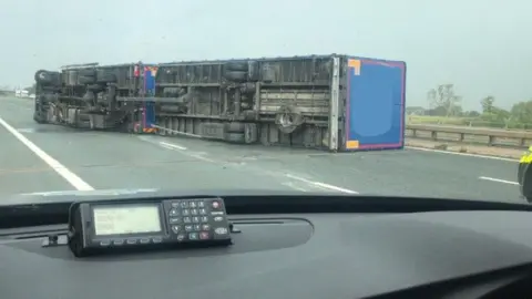 Cumbria Roads Police Lorry blown over on M6